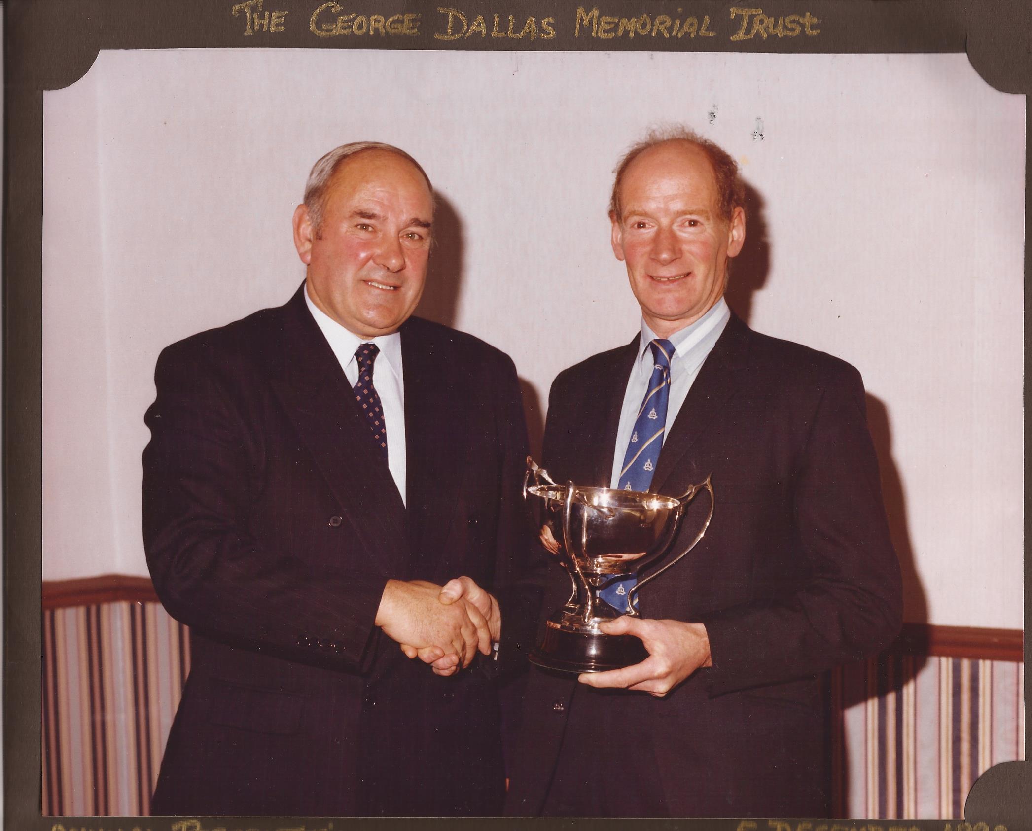 Danny presenting the Trust Trophy to Don Ritchie